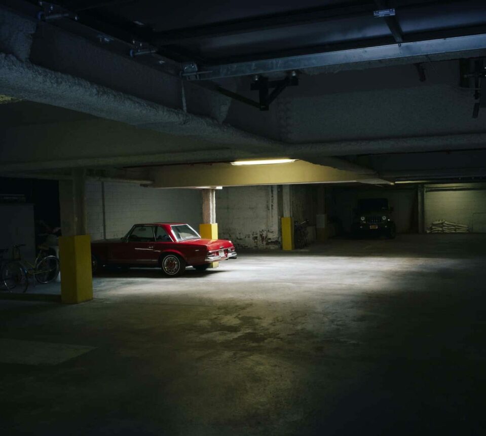 Car Parked In Illuminated Parking Lot