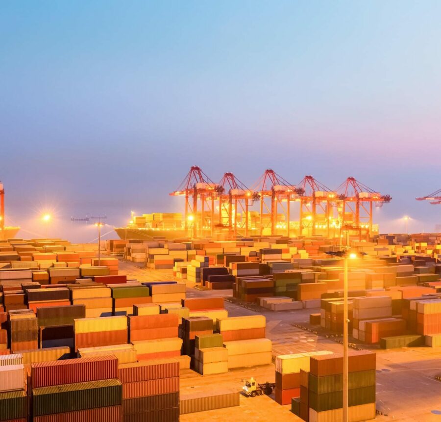 container wharf in nightfall, international import and export trade background