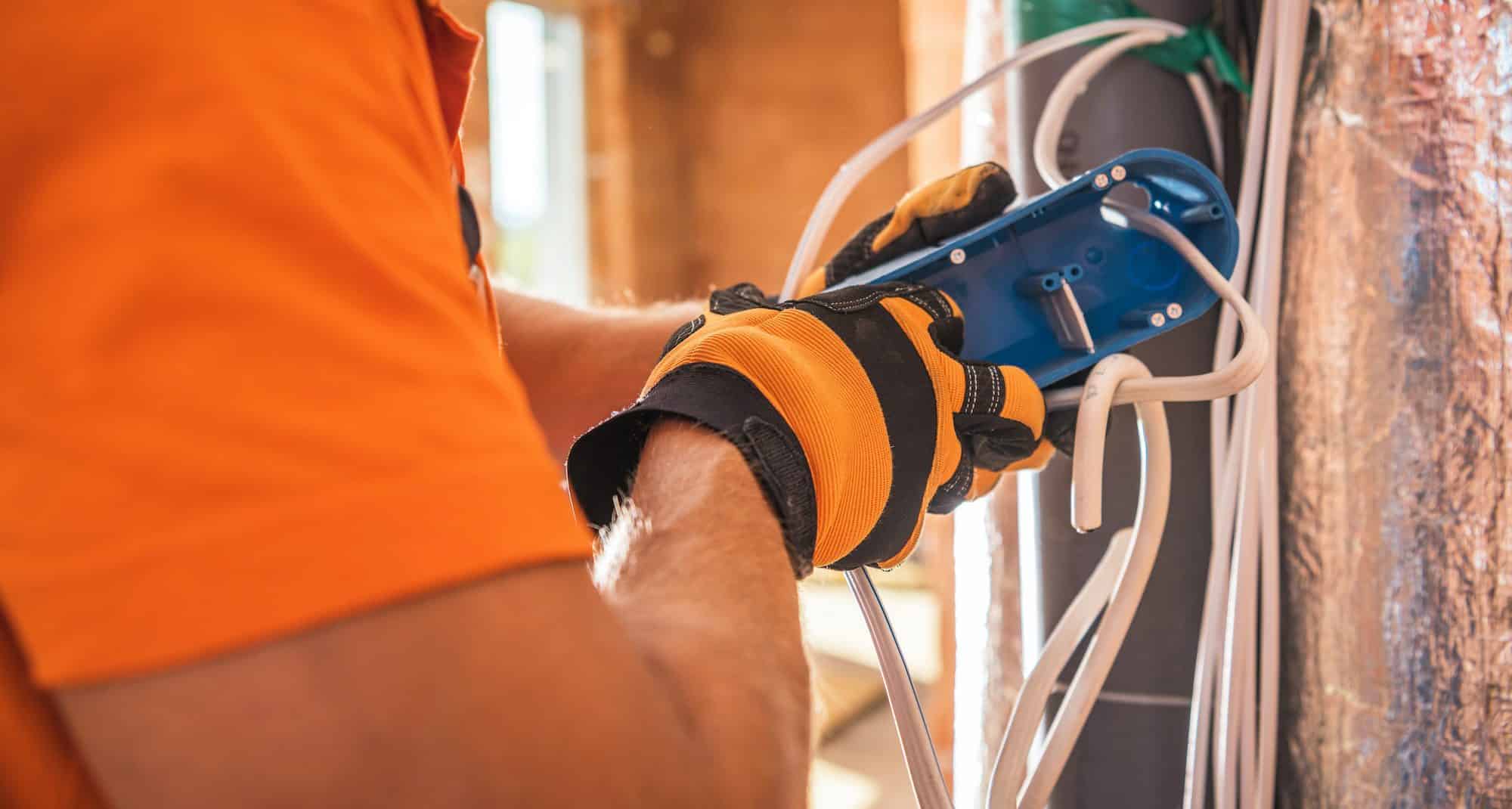 Electrician Preparing Electric Outlet