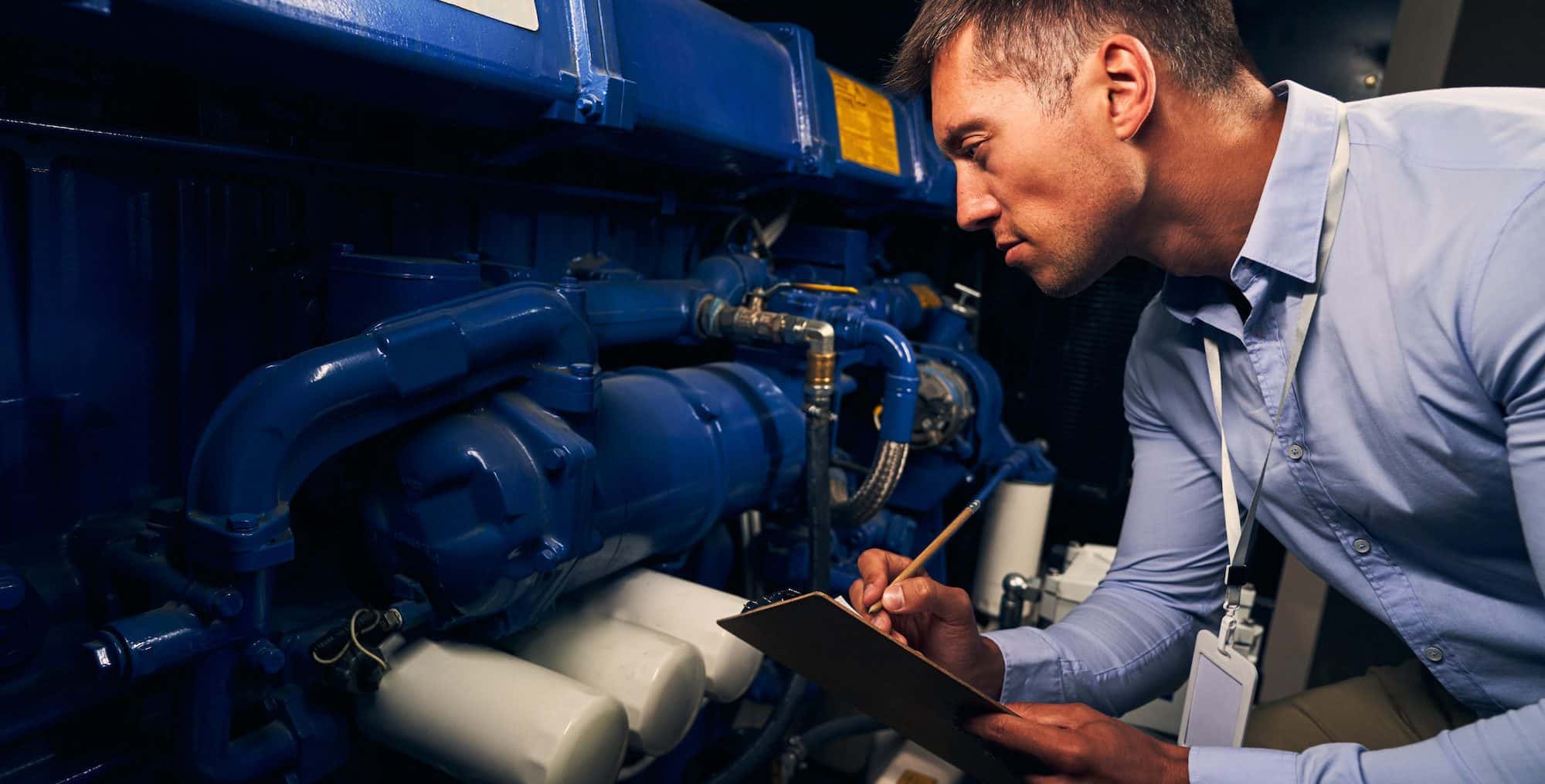 Engineer performing visual inspection of generating unit