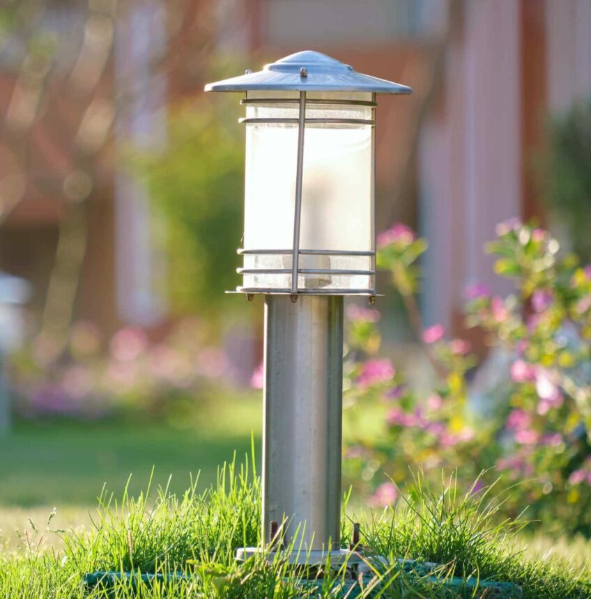 Outdoor lamp on yard lawn for garden lighting in summer park