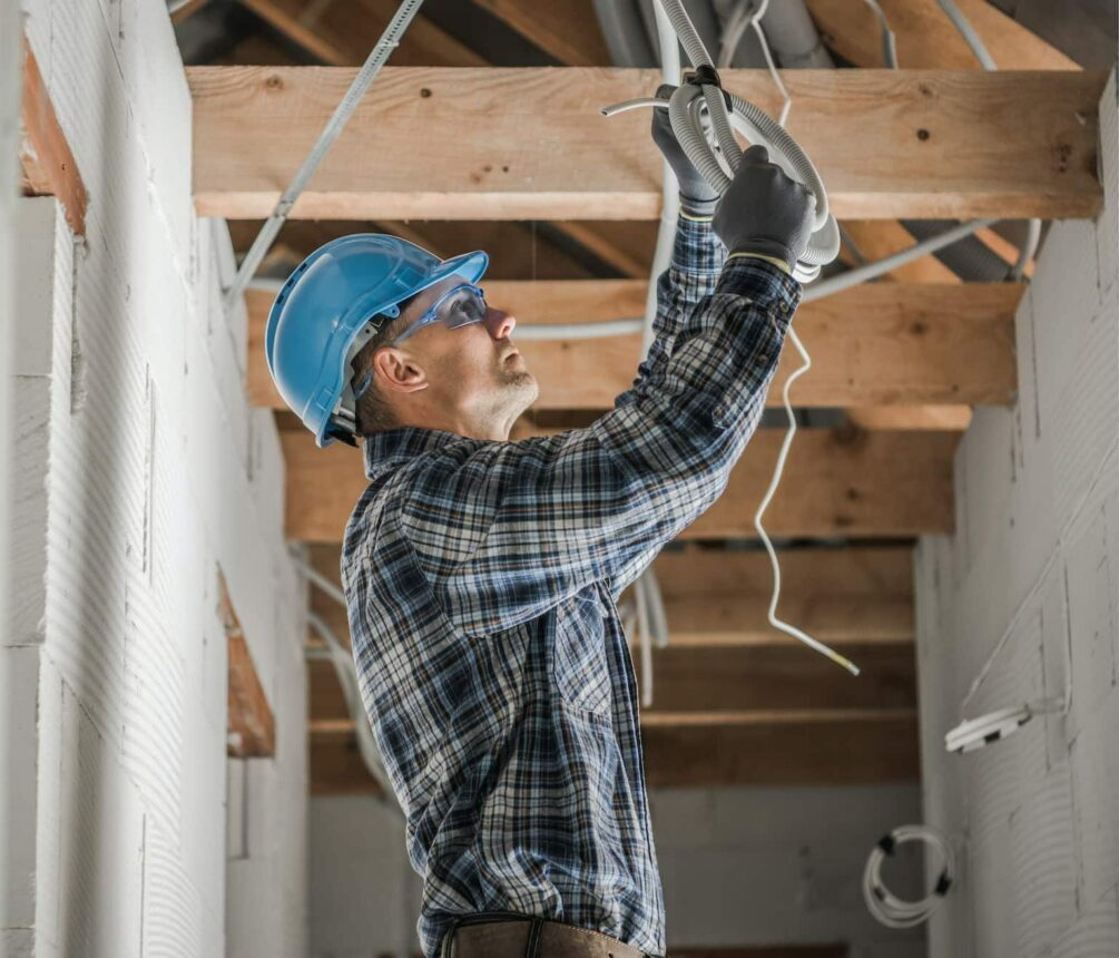 Professional Electrician Installing Ceiling Light Point