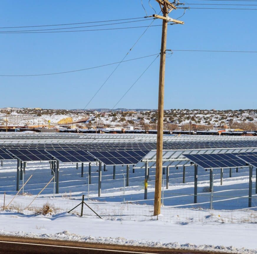 solar panels in winter view of snow covered solar panel park