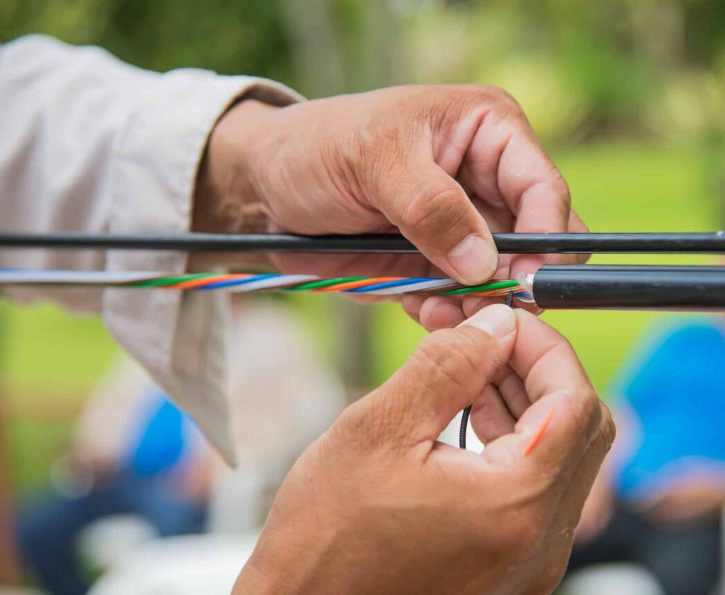 Technicians are installing optic fiber.