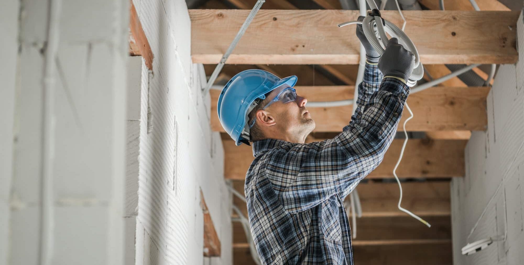 Professional Electrician Installing Ceiling Light Point